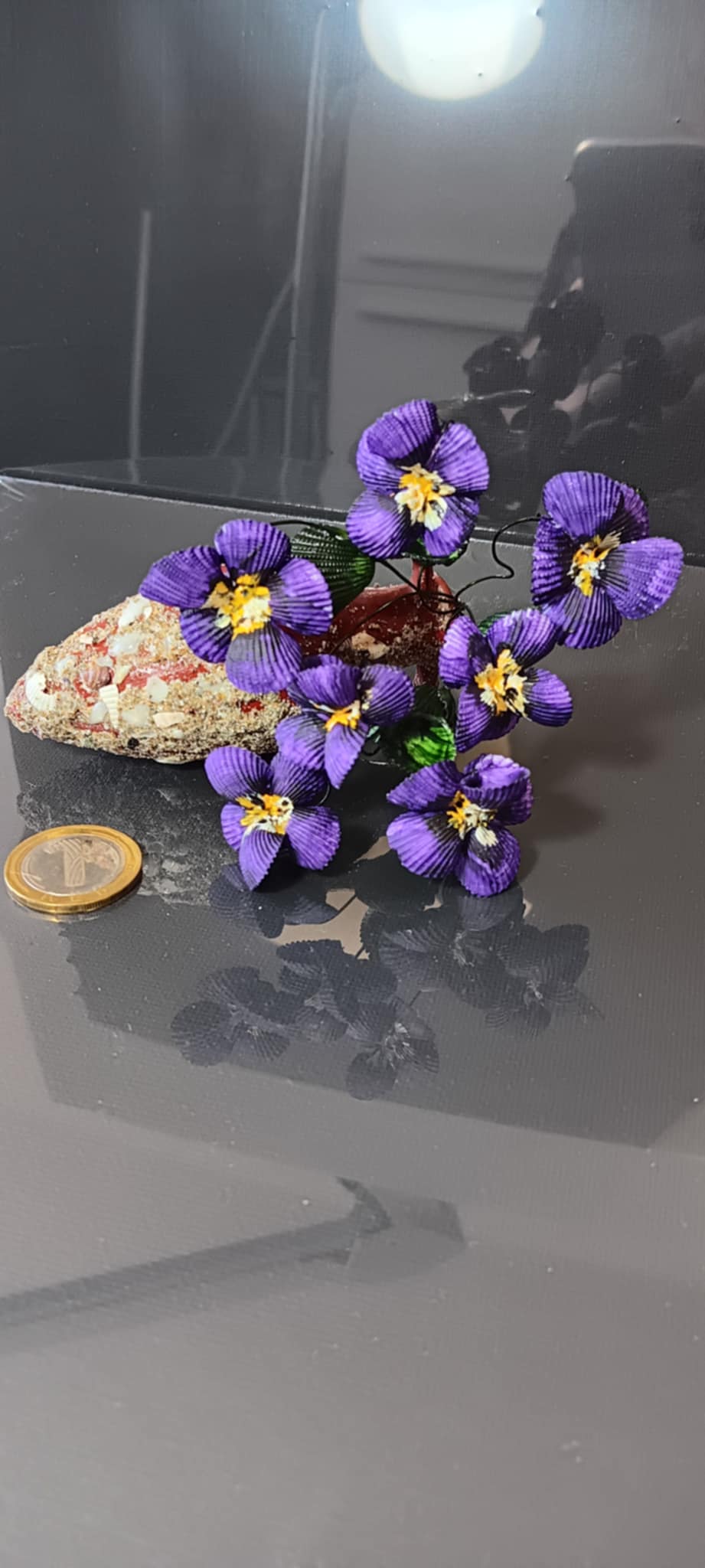 Handmade bouquets of seashells in an amphora