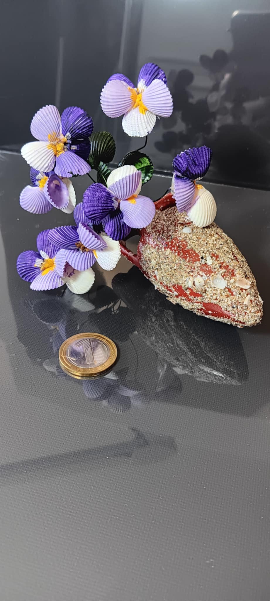 Handmade bouquets of seashells in an amphora