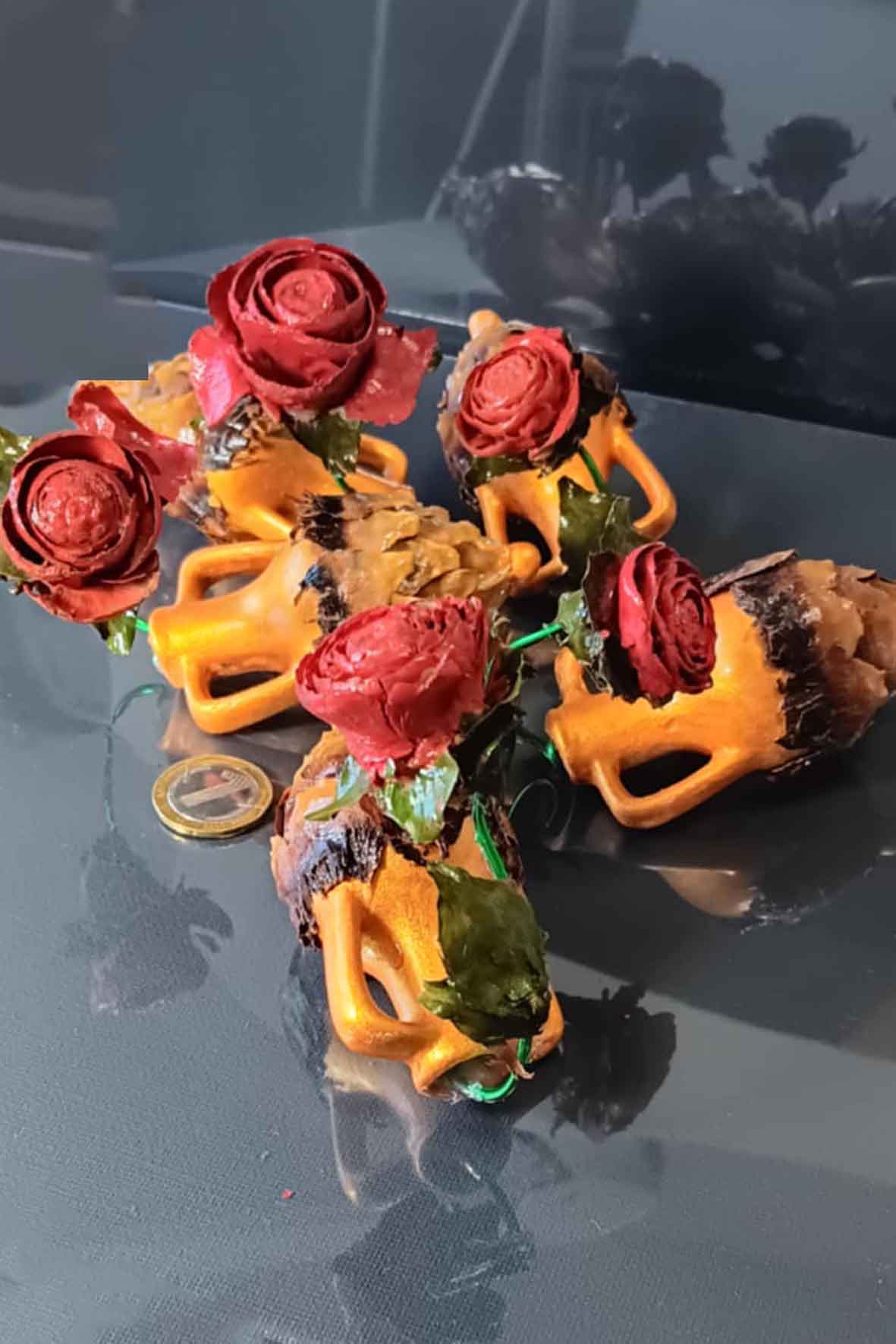 Handmade bouquets of pine cones in vases-from the Mountains