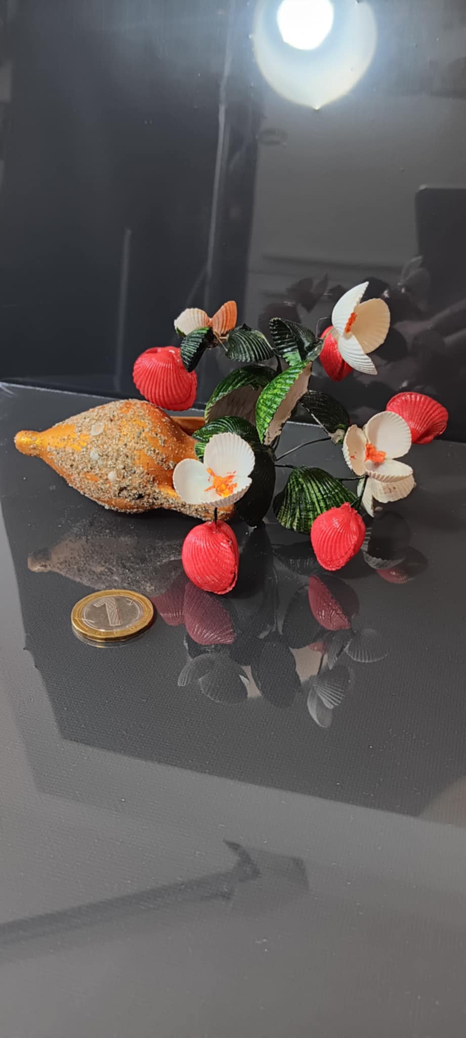 Handmade bouquets of seashells in an amphora