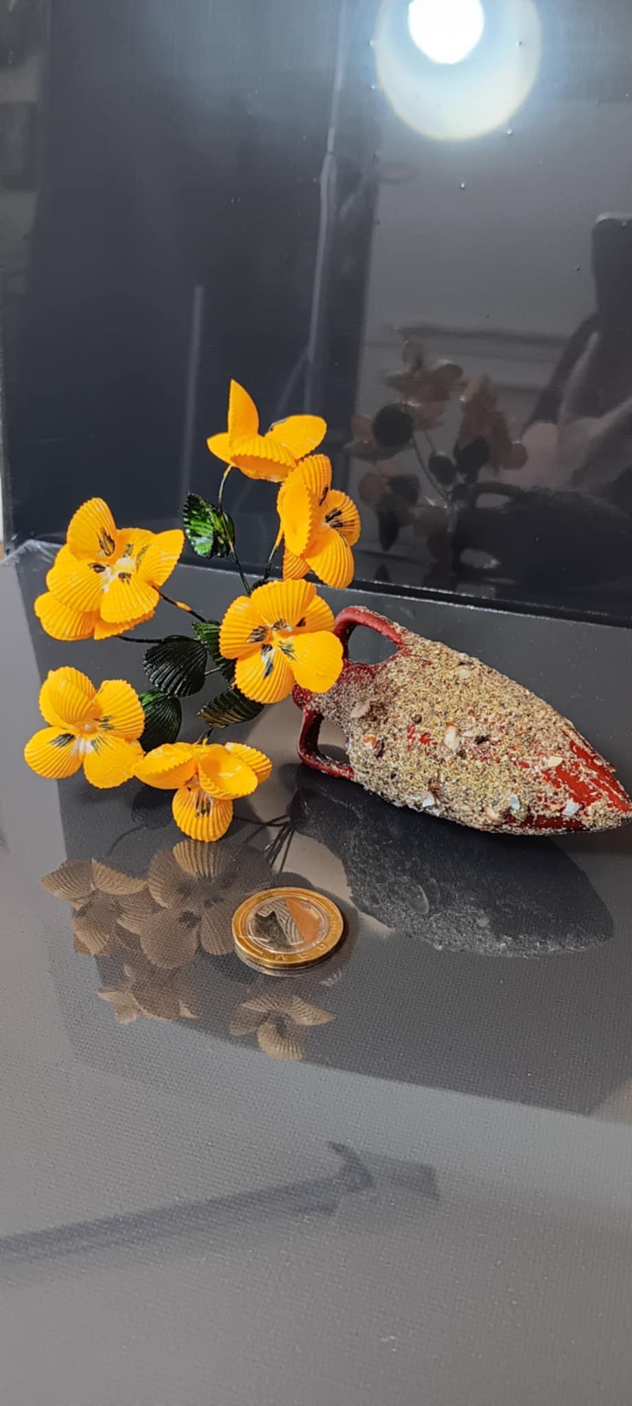 Handmade bouquets of seashells in an amphora